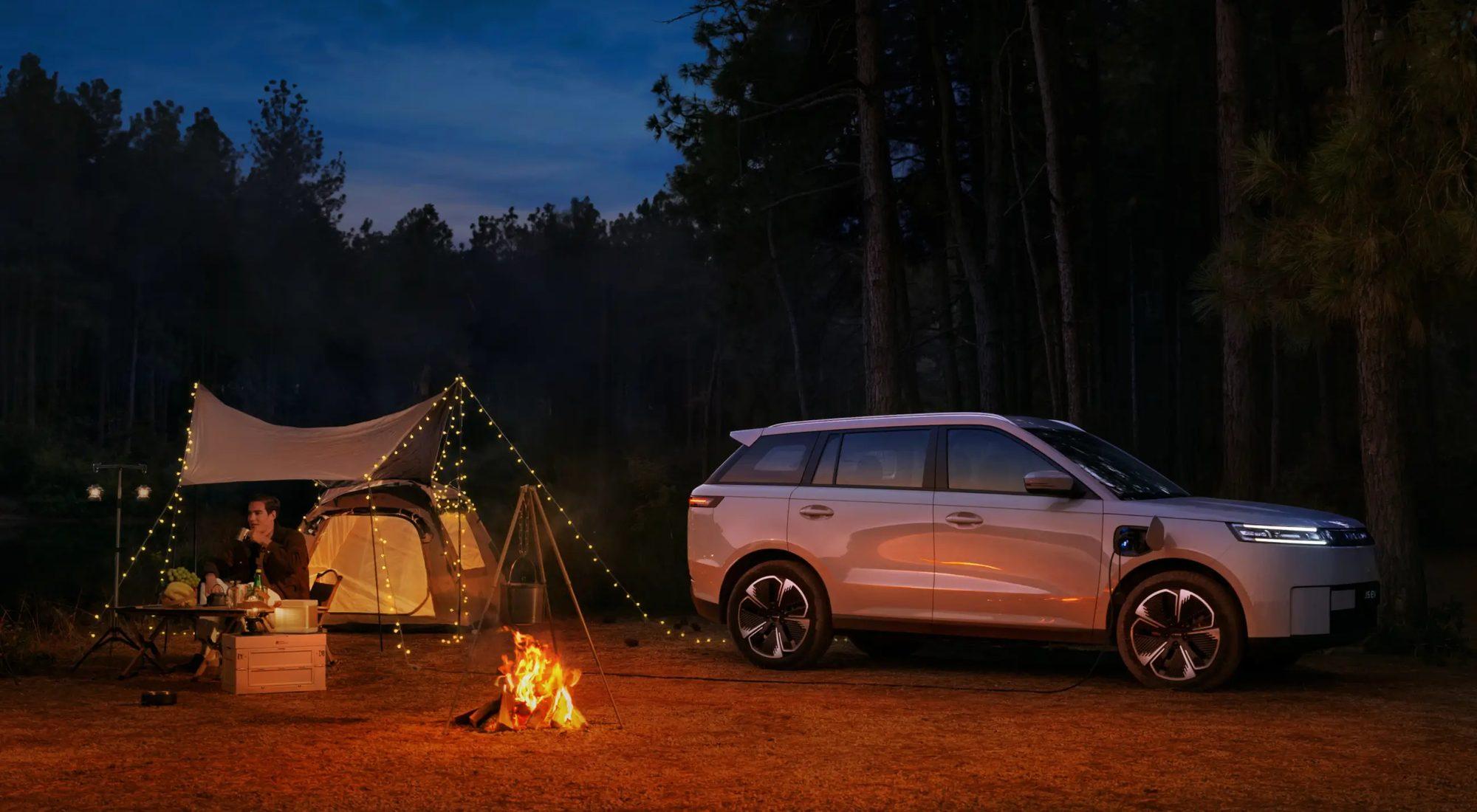 Jaecoo J5 EV at a campsite at night