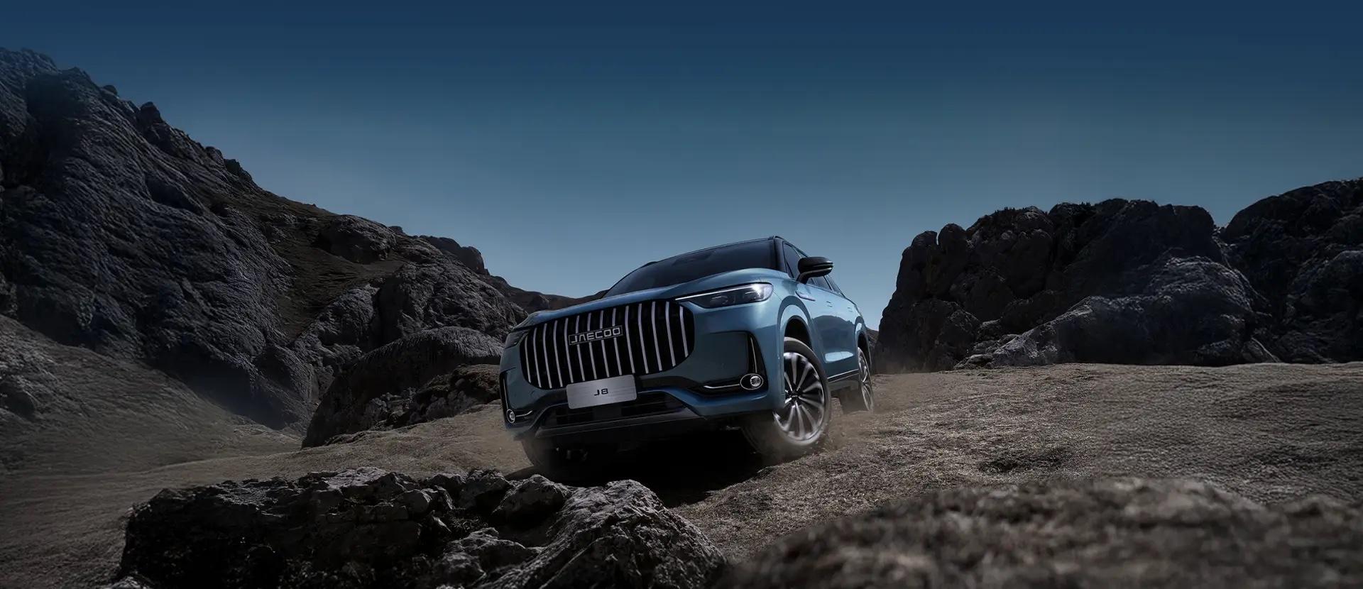 Jaecoo J8 in a desert at night